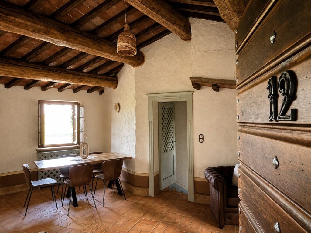 Dining room with a wooden dresser in the Il belvedere apartment, Borgo Braila, Umbria