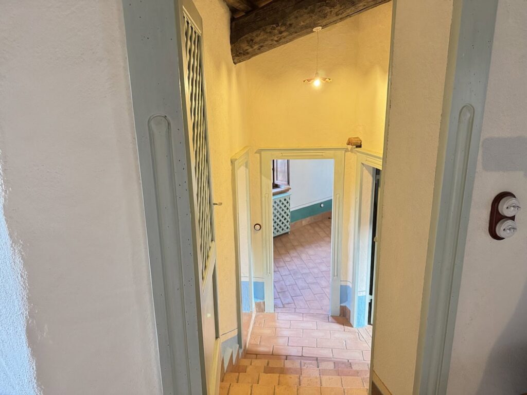 Hallway leading through the apartment in the Il belvedere apartment, Borgo Braila, Umbria