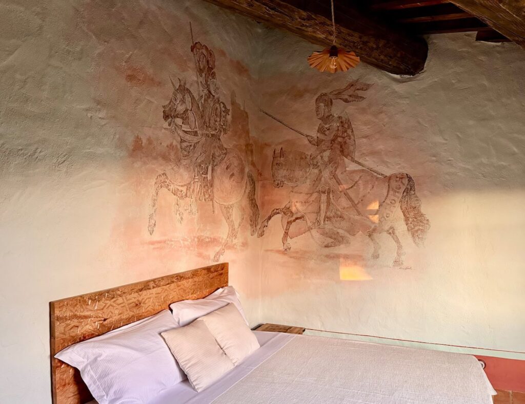 Master bedroom with the knight (il cavaliere) fresco in the Il cavaliere apartment, Borgo Braila, Umbria