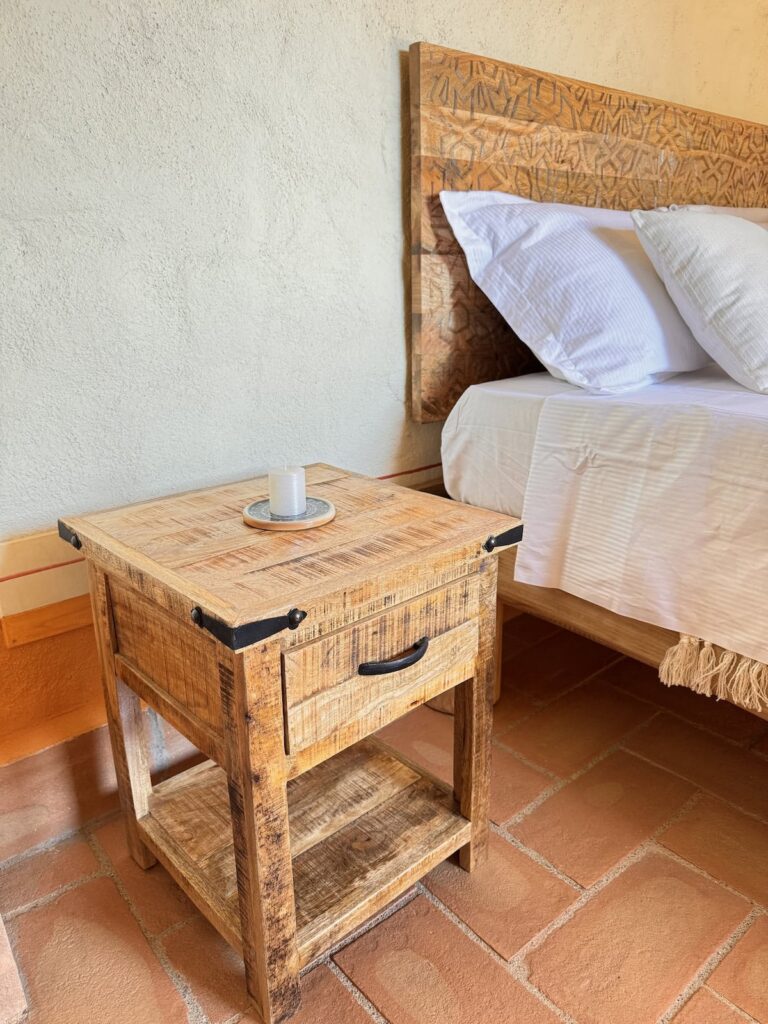 Handcrafted wooden bedside table in the La carta apartment, Borgo Braila, Umbria