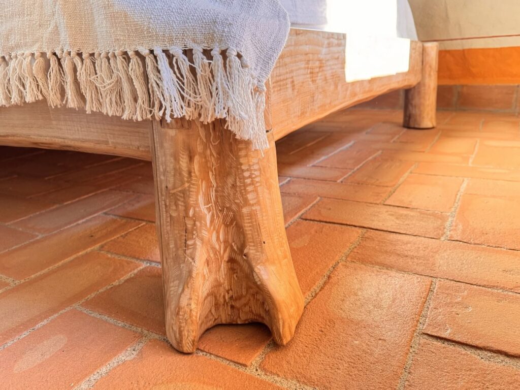 Rustic wooden table detail in the La carta apartment, Borgo Braila, Umbria