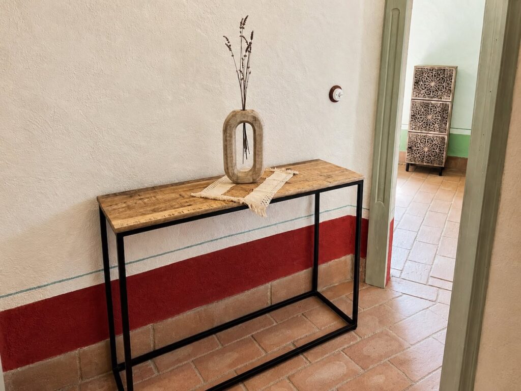 Console table detail in the Il ponente apartment, Borgo Braila, Umbria