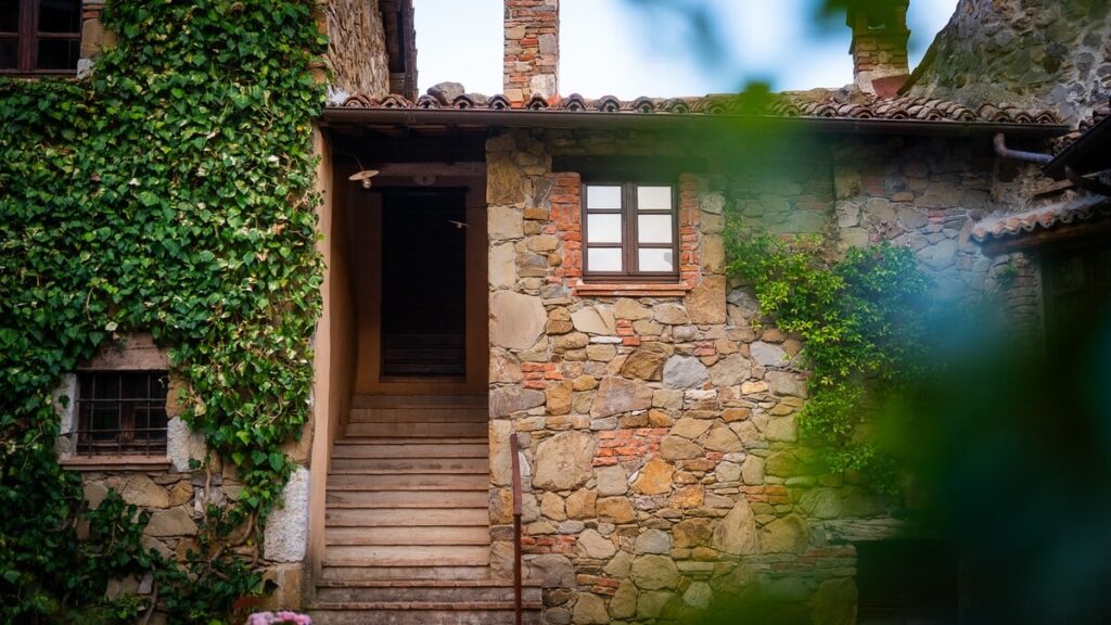 Stone facade of the medieval village in the Il ponente apartment, Borgo Braila, Umbria