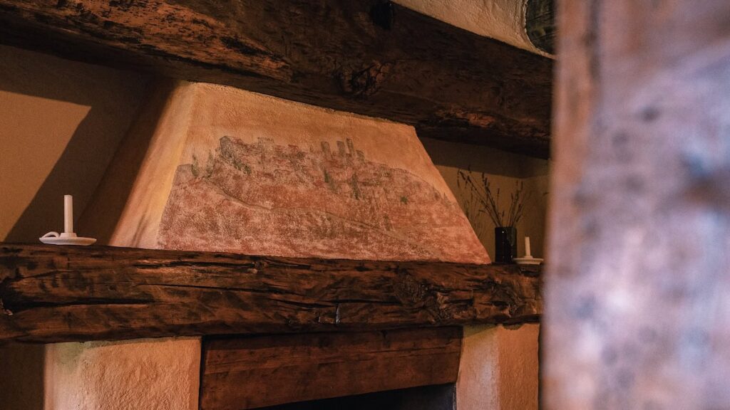 Painted beam and cushion detail in the Il cardinale apartment, Borgo Braila, Umbria