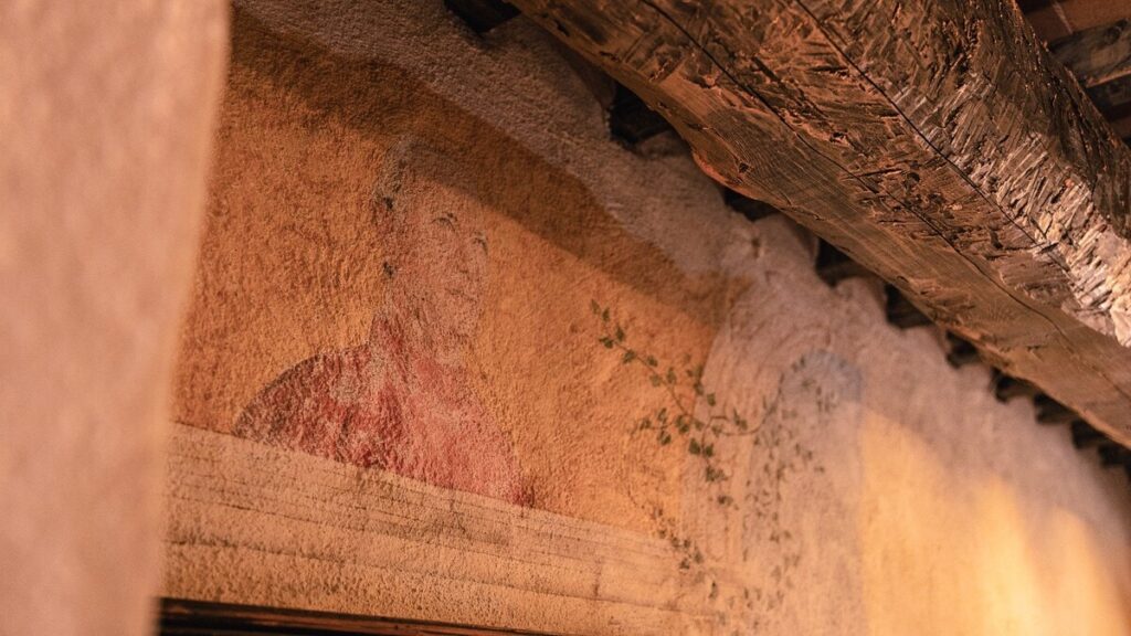 Hand-painted wall fresco detail in the Il cardinale apartment, Borgo Braila, Umbria