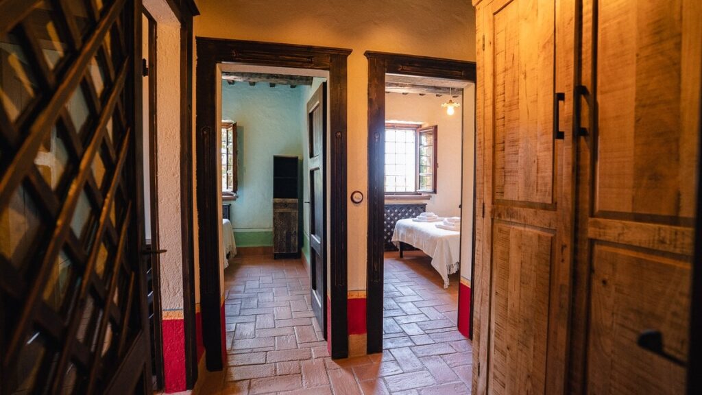 Hallway with a lattice door in the Il cardinale apartment, Borgo Braila, Umbria