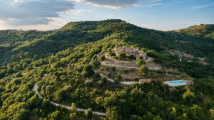 Aerial view of Borgo Braila and the surrounding Umbrian countryside and olive groves