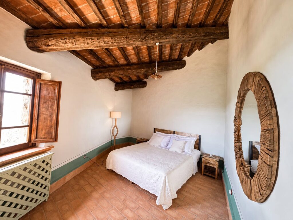 Comfortable bedroom in the Il cavaliere apartment at Borgo Braila, Umbria