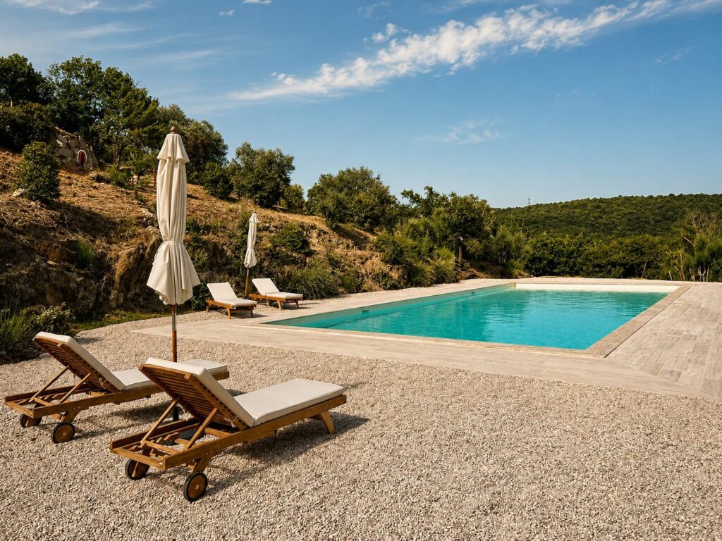 Sun terrace beside the travertine pool at Borgo Braila, Umbria