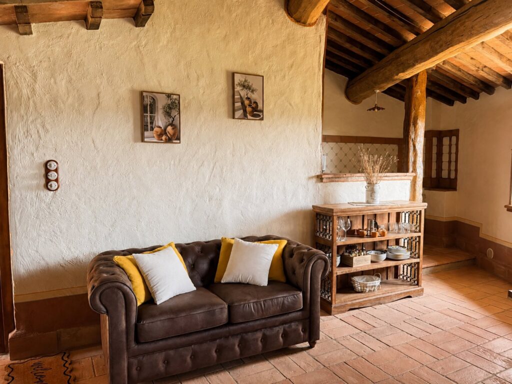 Dining area with exposed beams in a Borgo Braila apartment at Borgo Braila