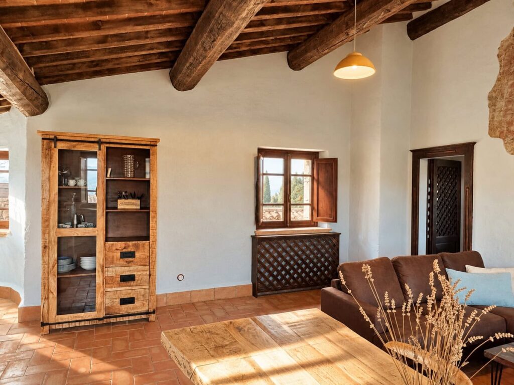 Living room with a wooden cabinet and corner sofa in the La Casa Nobile apartment, Borgo Braila, Umbria